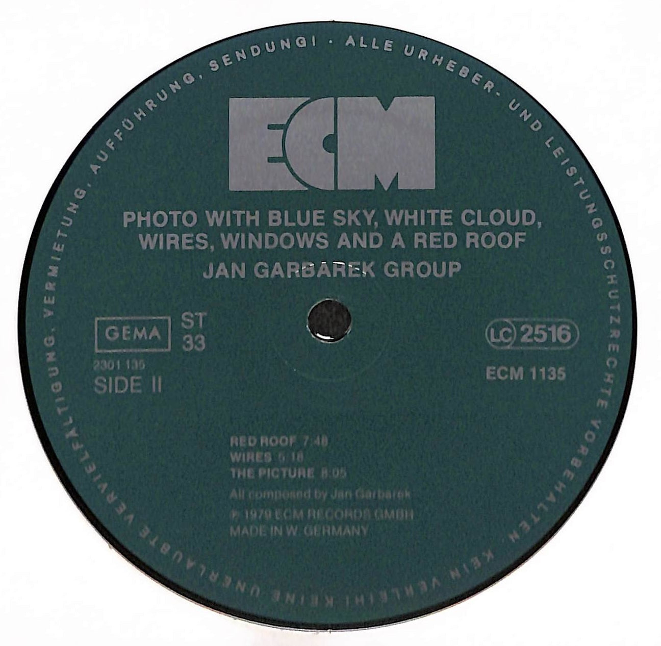 Photo With Blue Sky, White Cloud, Wires, Windows And A Red Roof