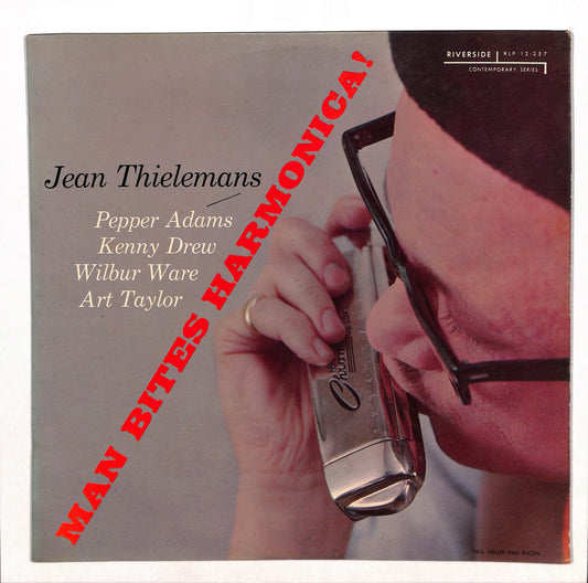 Man Bites Harmonica!
