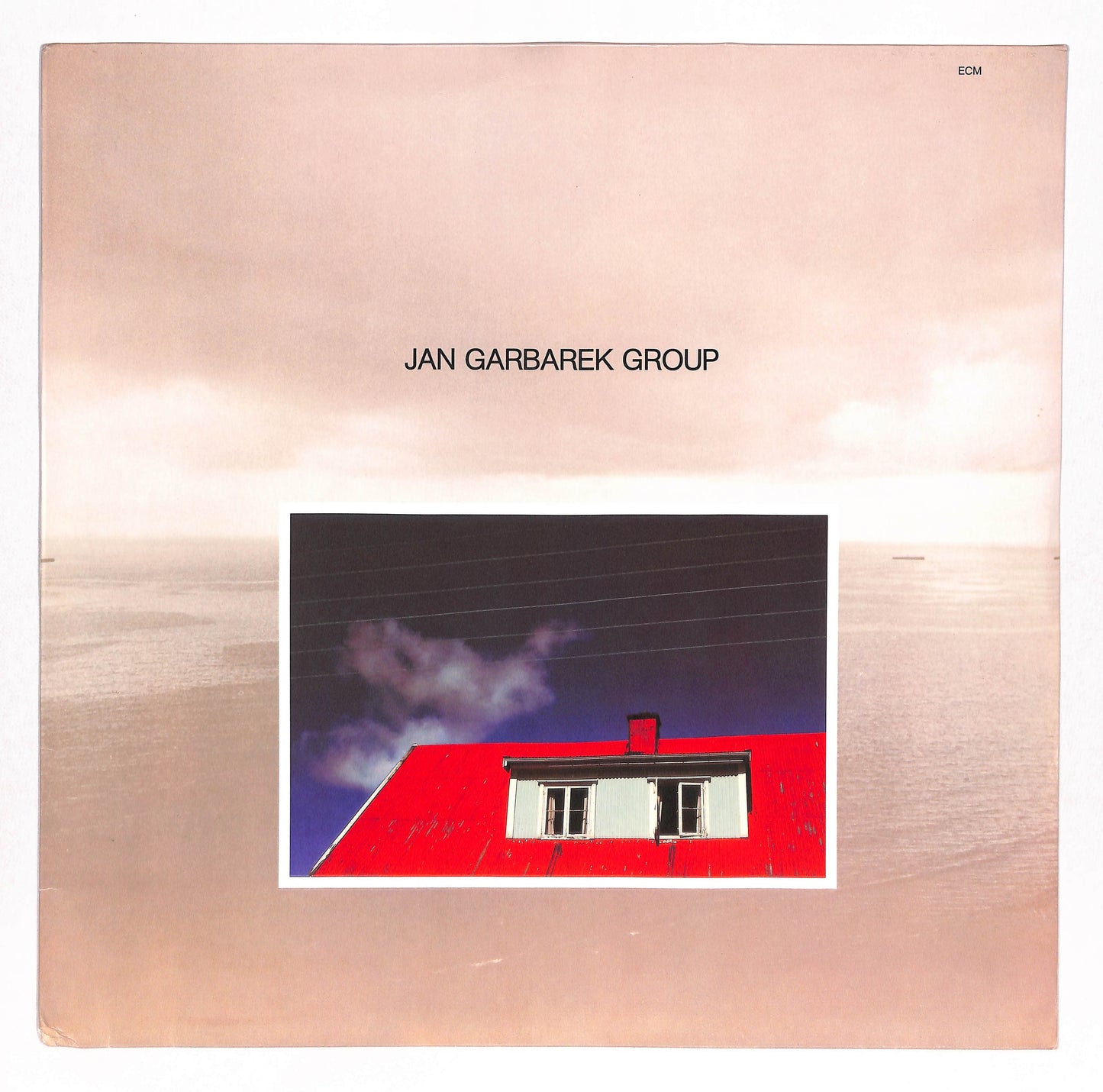 Photo With Blue Sky, White Cloud, Wires, Windows And A Red Roof