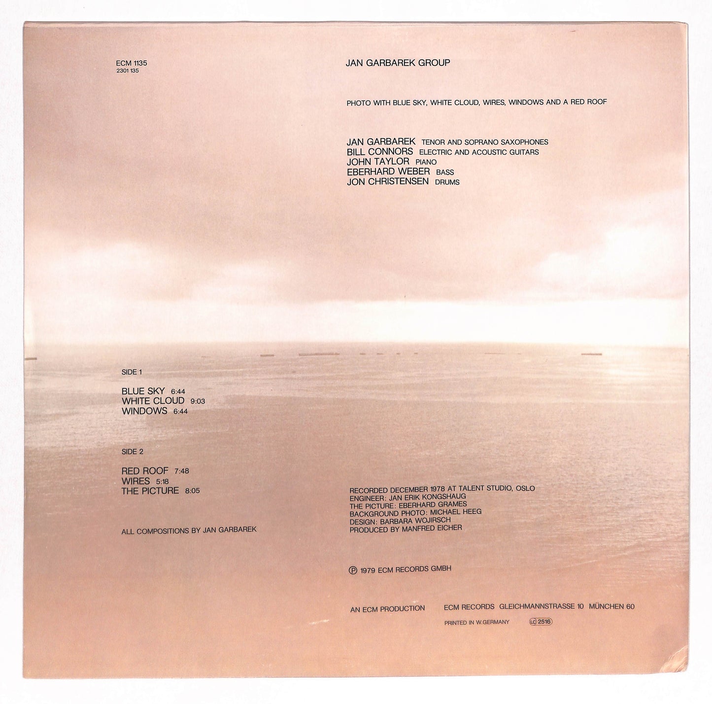 Photo With Blue Sky, White Cloud, Wires, Windows And A Red Roof